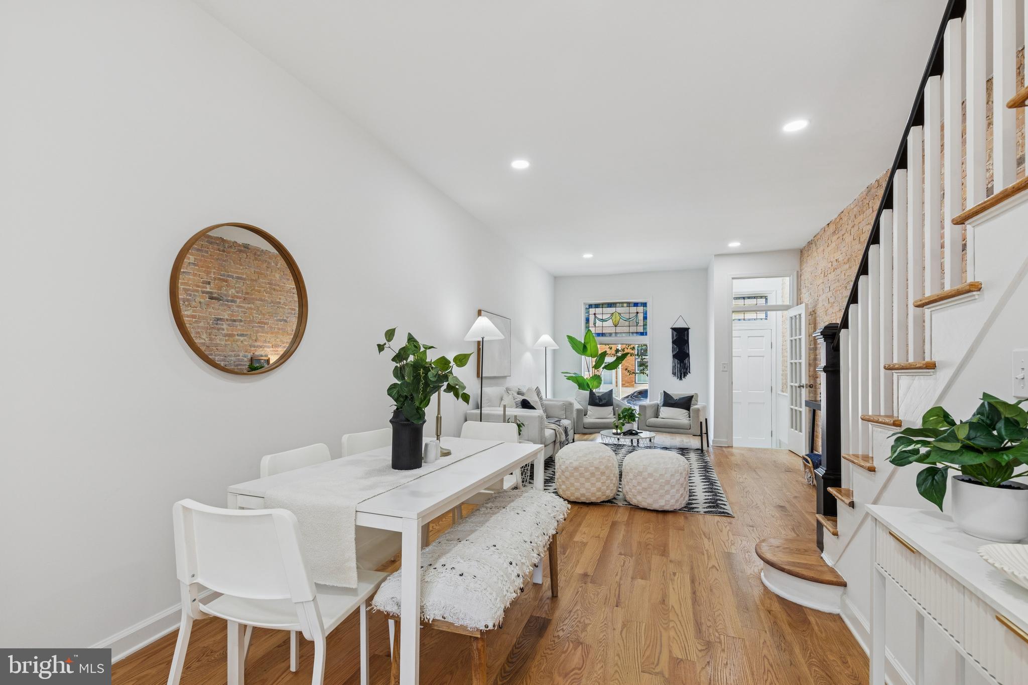 630 South Potomac Street Baltimore, MD 21224 - Photo 14 of 52 a living room with furniture a chandelier a mirror and a potted plant