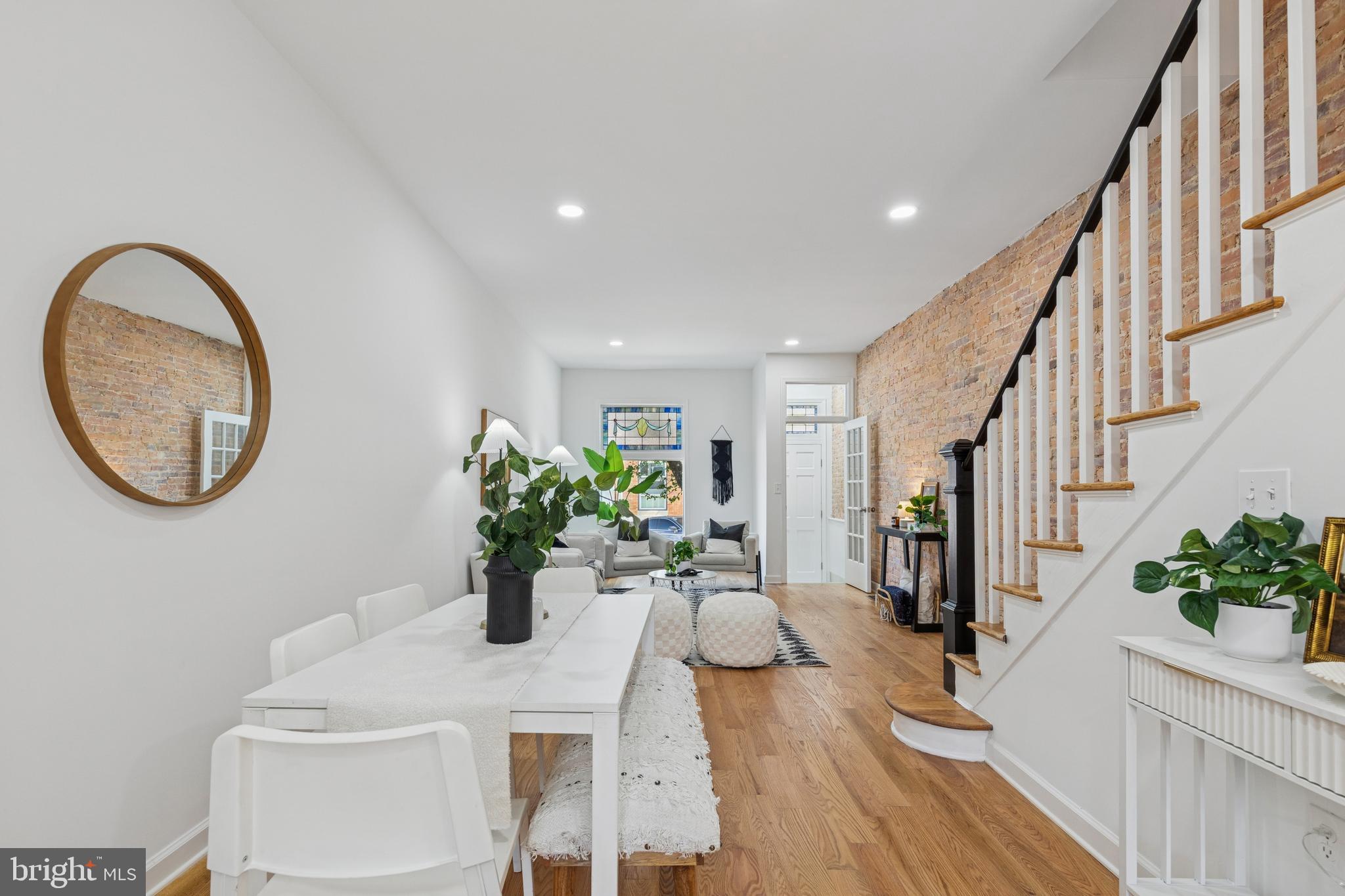 630 South Potomac Street Baltimore, MD 21224 - Photo 15 of 52 a dining room with furniture potted plants and wooden floor