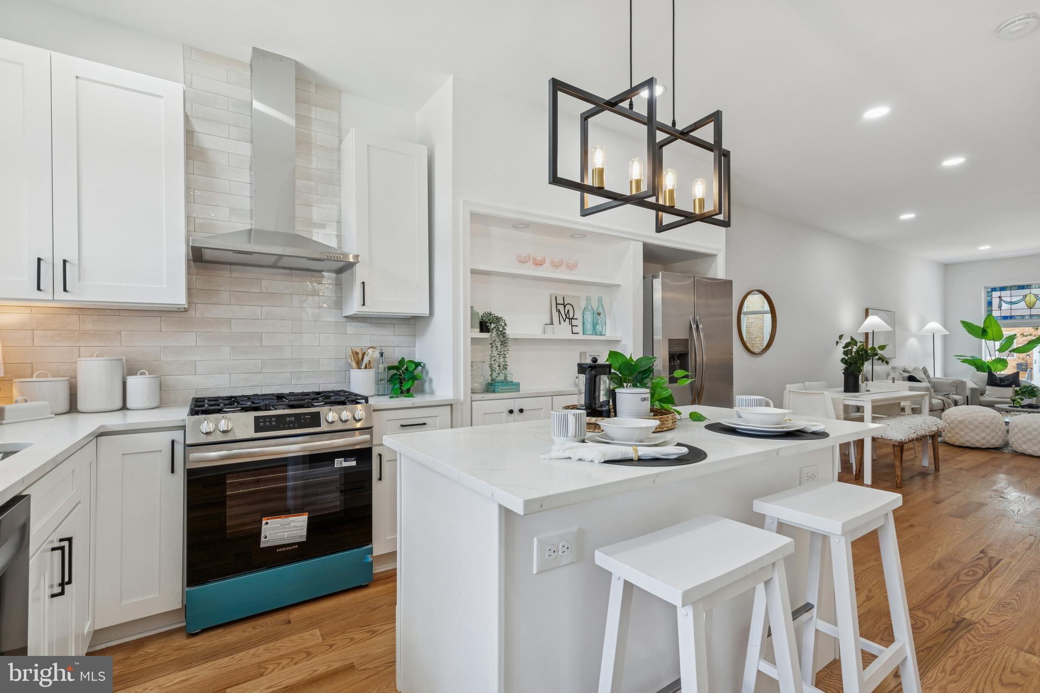 630 South Potomac Street Baltimore, MD 21224 - Photo 17 of 52 a kitchen with stainless steel appliances a stove a sink and a refrigerator