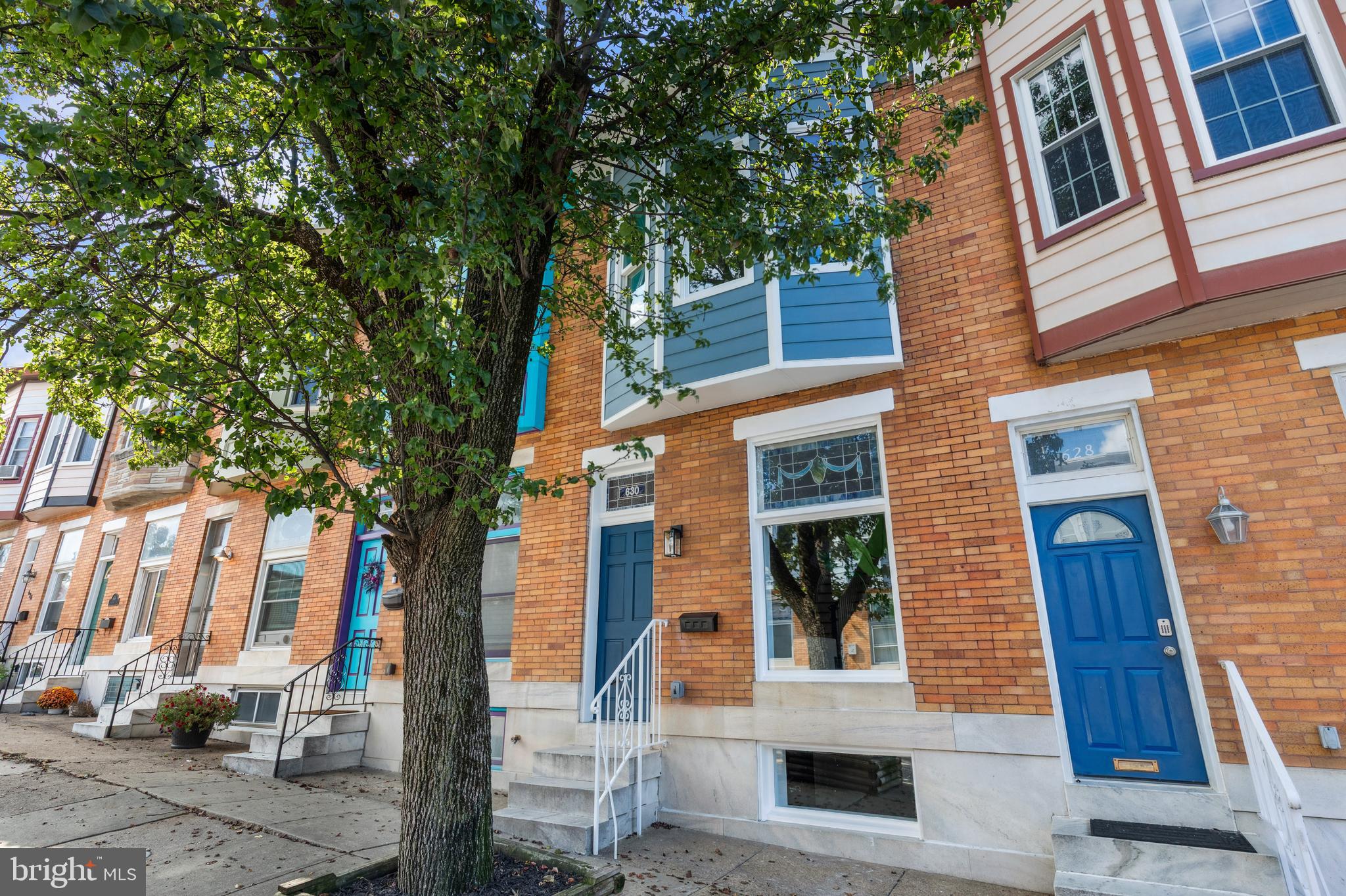 630 South Potomac Street Baltimore, MD 21224 - Photo 2 of 52 a front view of a house with a tree