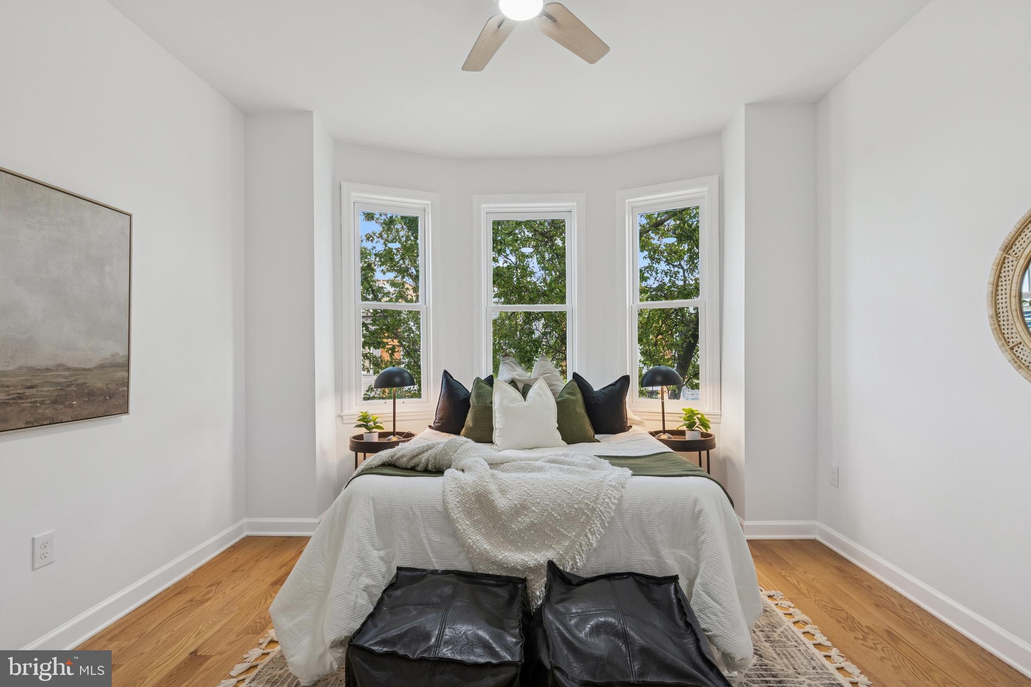 630 South Potomac Street Baltimore, MD 21224 - Photo 27 of 52 a bedroom with a bed and a chandelier