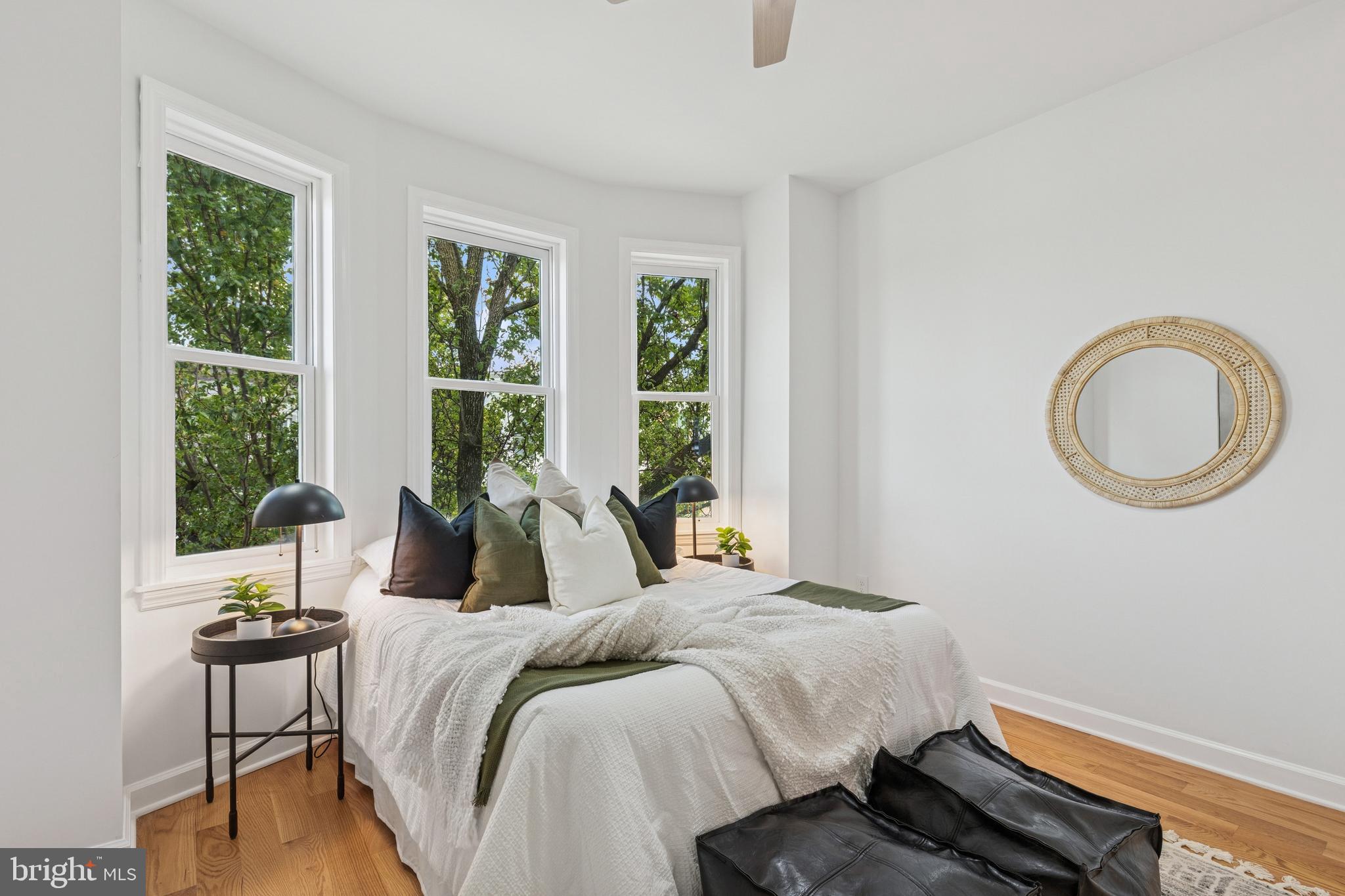 630 South Potomac Street Baltimore, MD 21224 - Photo 30 of 52 a bedroom with a bed and a large window