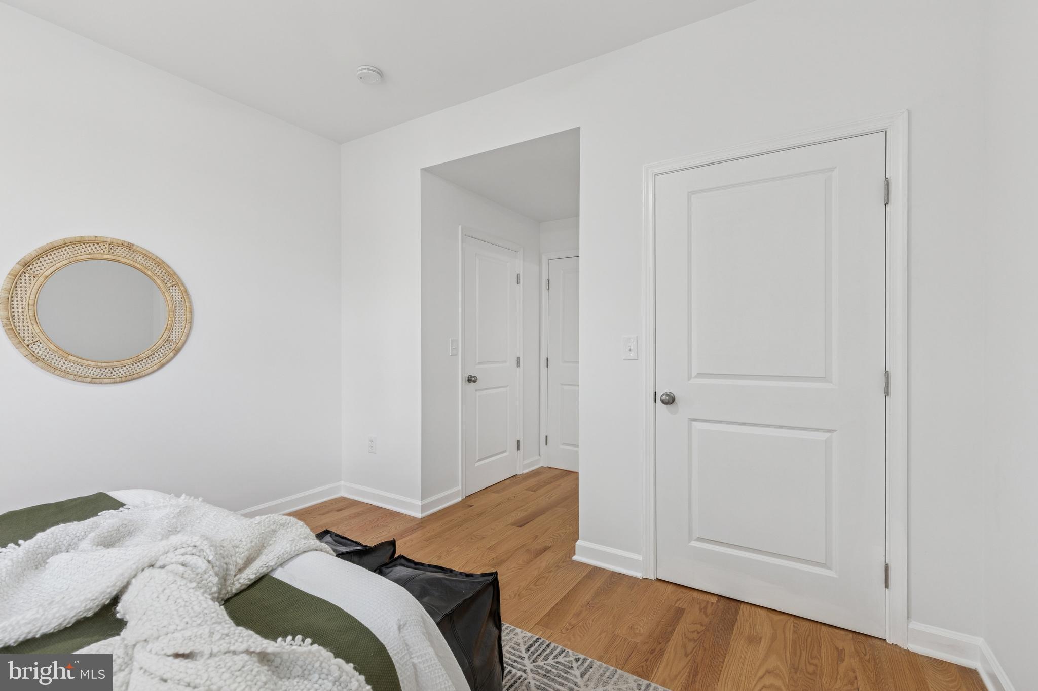 630 South Potomac Street Baltimore, MD 21224 - Photo 31 of 52 a bedroom with a bed and a mirror