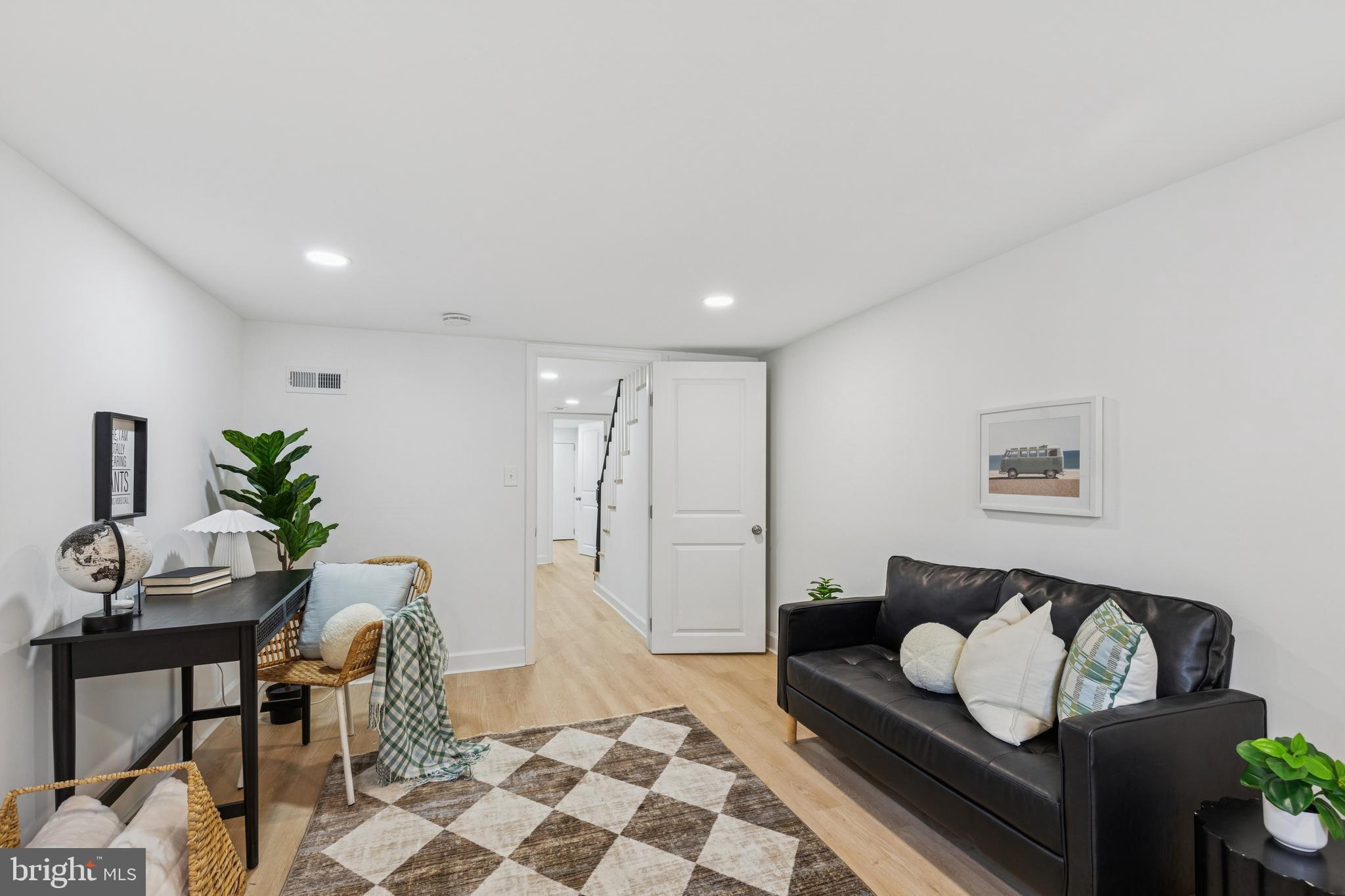 630 South Potomac Street Baltimore, MD 21224 - Photo 34 of 52 a living room with furniture and wooden floor