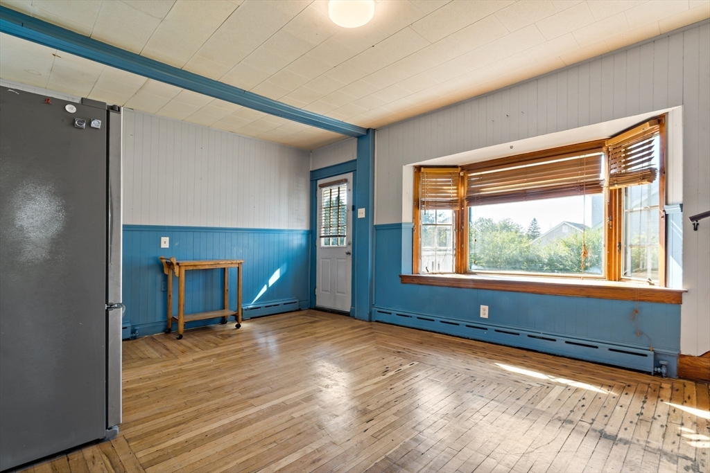 37 Merton Street Somerset, MA 02726 - Photo 11 of 36 a view of empty room with wooden floor and fan