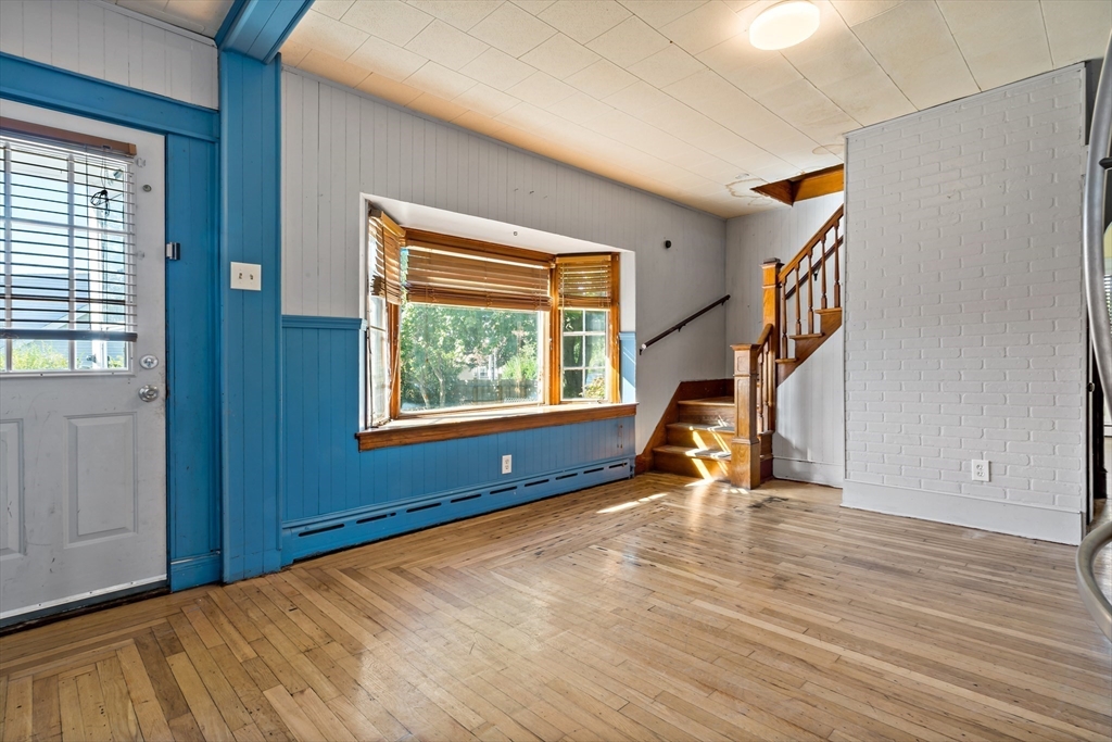 37 Merton Street Somerset, MA 02726 - Photo 12 of 36 a view of an empty room with stairs and a window