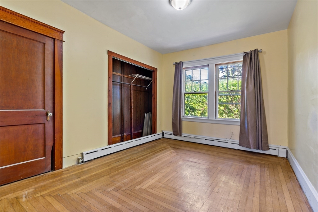 37 Merton Street Somerset, MA 02726 - Photo 16 of 36 an empty room with wooden floor and windows