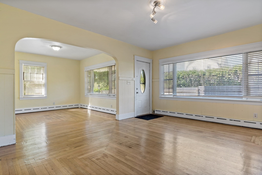 37 Merton Street Somerset, MA 02726 - Photo 4 of 36 a view of an empty room with a window and wooden floor