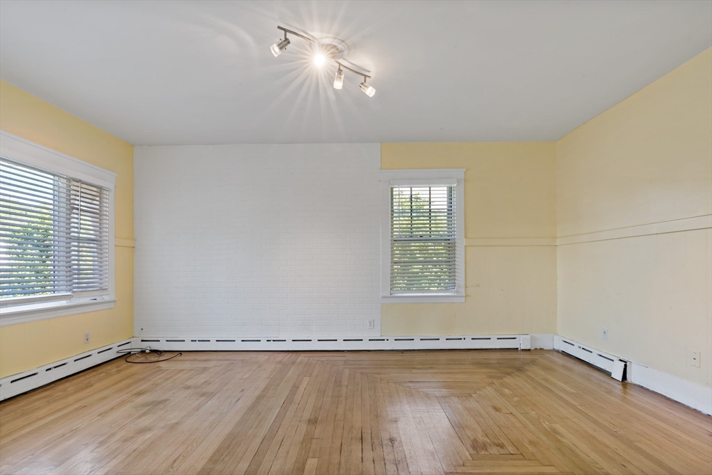37 Merton Street Somerset, MA 02726 - Photo 6 of 36 an empty room with wooden floor and windows