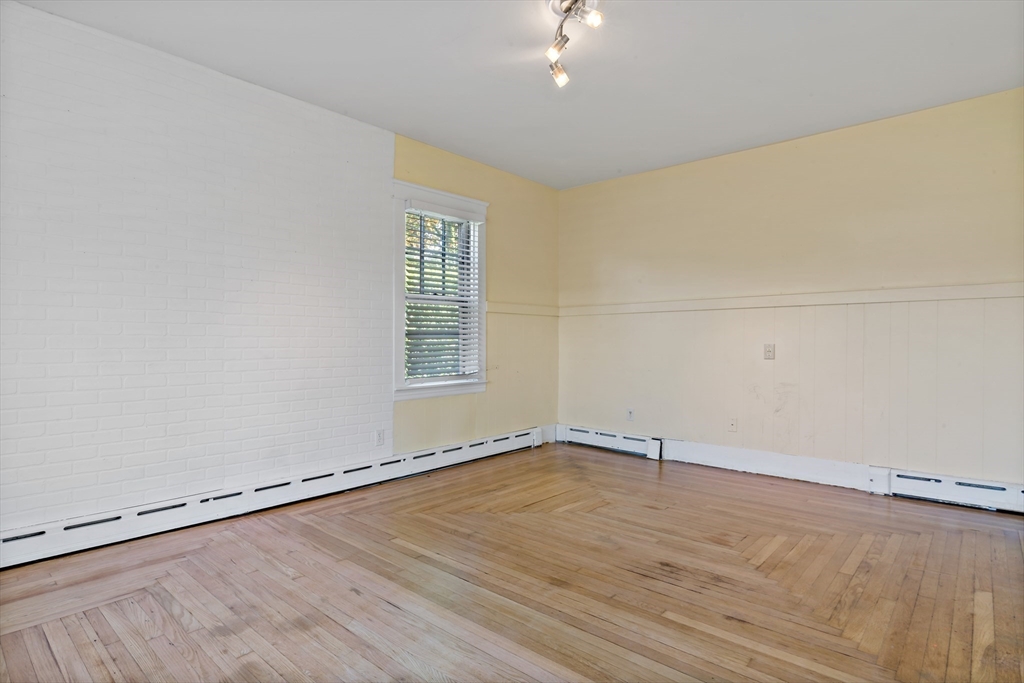 37 Merton Street Somerset, MA 02726 - Photo 7 of 36 wooden floor in an empty room with a window