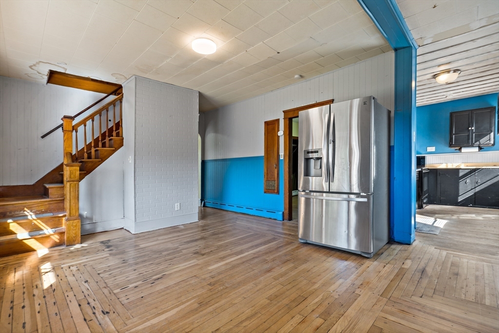 37 Merton Street Somerset, MA 02726 - Photo 10 of 36 a view of kitchen with refrigerator and wooden floor
