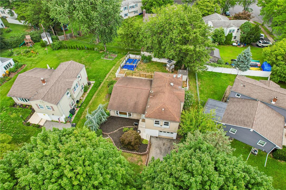 2428 Nottingham Road Bethlehem, PA 18017 - Photo 46 of 48 An aerial perspective reveals a charming residential property with ample green space and a driveway leading to an integrated garage.