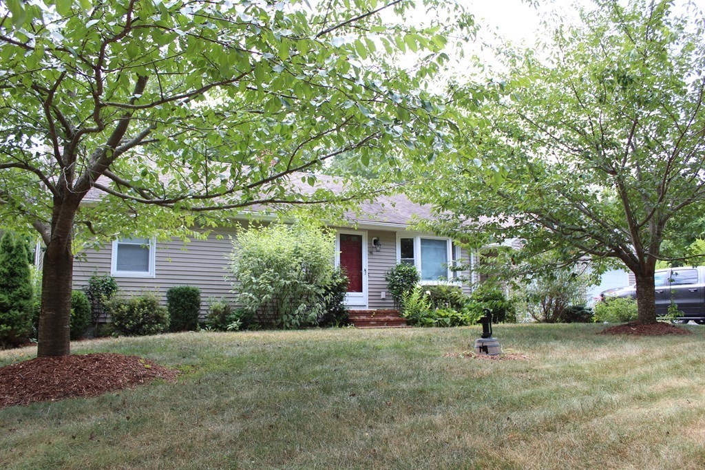 46 Quaker Lane Rochester, MA 02770 - Photo 1 of 25 a front view of a house with garden