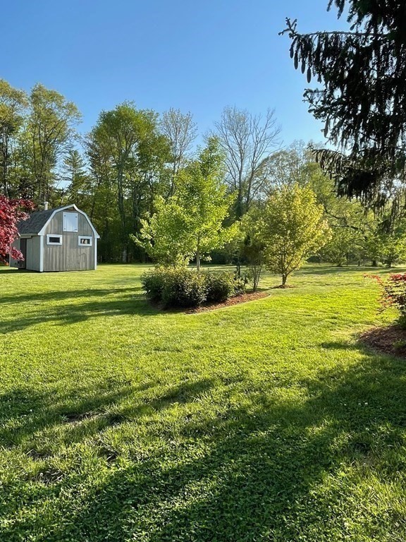 46 Quaker Lane Rochester, MA 02770 - Photo 4 of 25 a view of a house with a big yard
