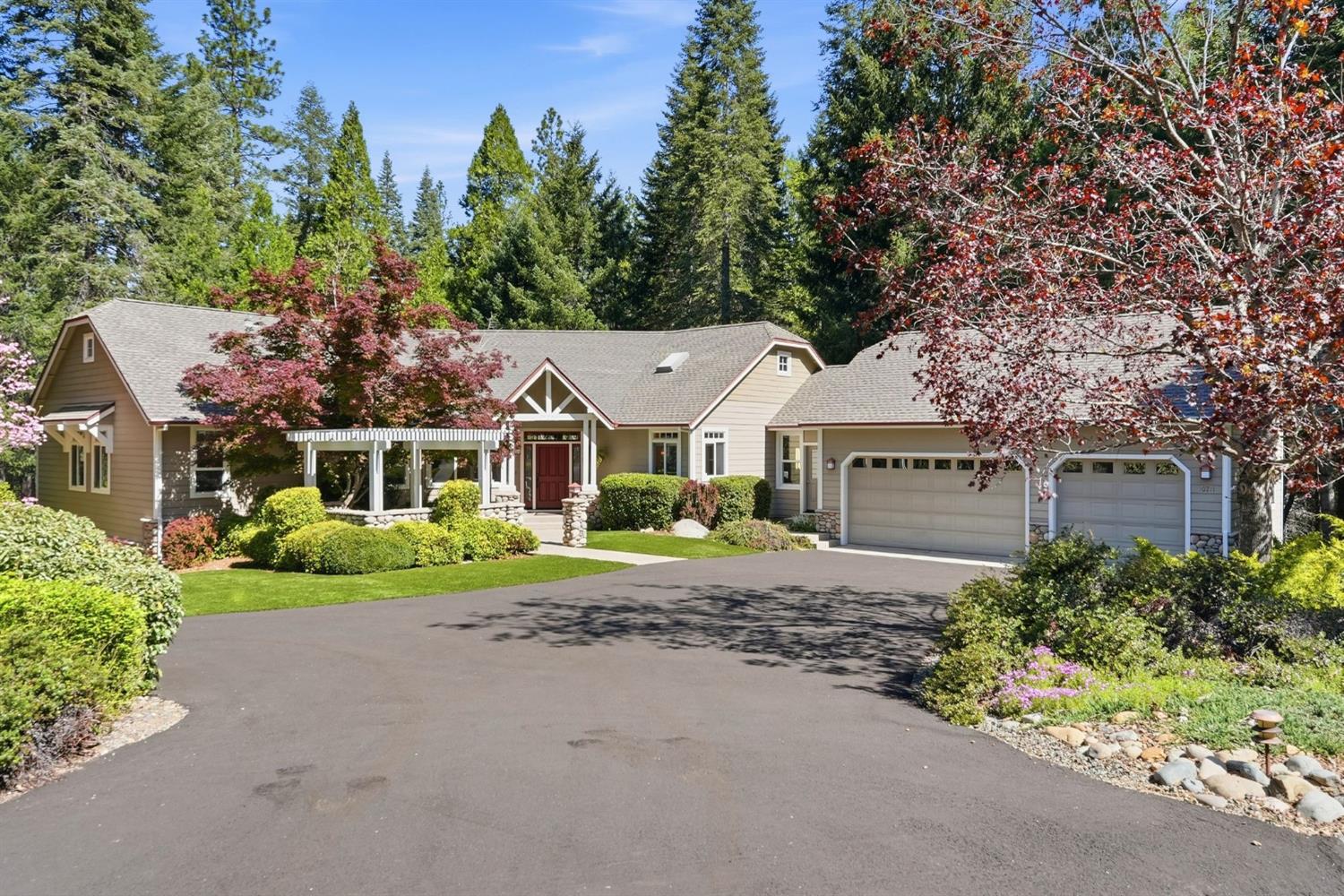 a front view of a house with a garden