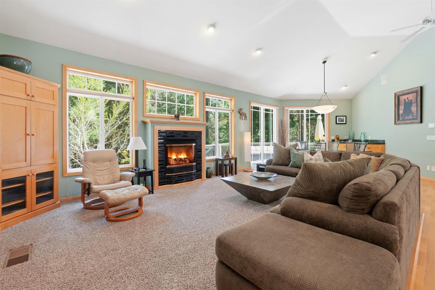 10711 Murchie Mine Road Nevada City, CA 95959 - Photo 13 of 71 a living room with furniture large window and a fireplace