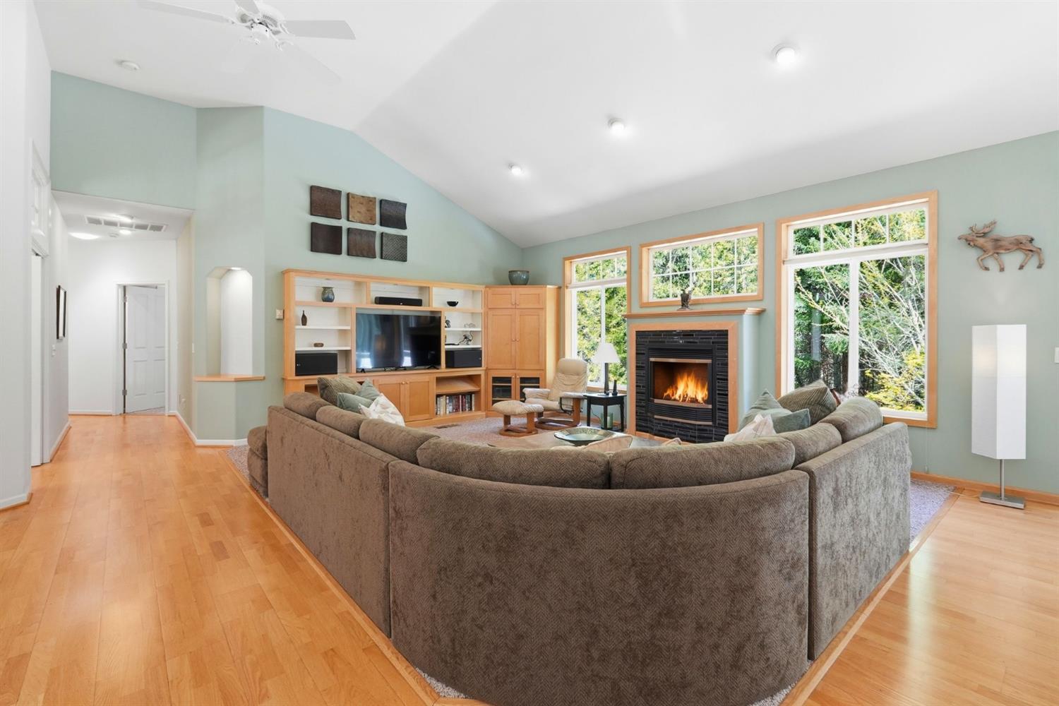 10711 Murchie Mine Road Nevada City, CA 95959 - Photo 14 of 71 a living room with furniture a large window and a fireplace