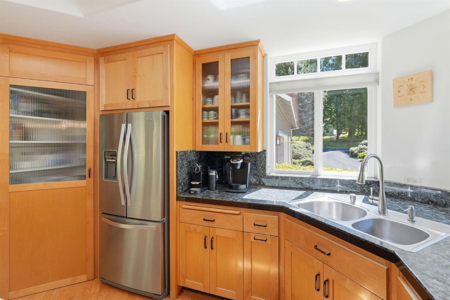 10711 Murchie Mine Road Nevada City, CA 95959 - Photo 19 of 71 a kitchen with stainless steel appliances granite countertop a refrigerator and a sink
