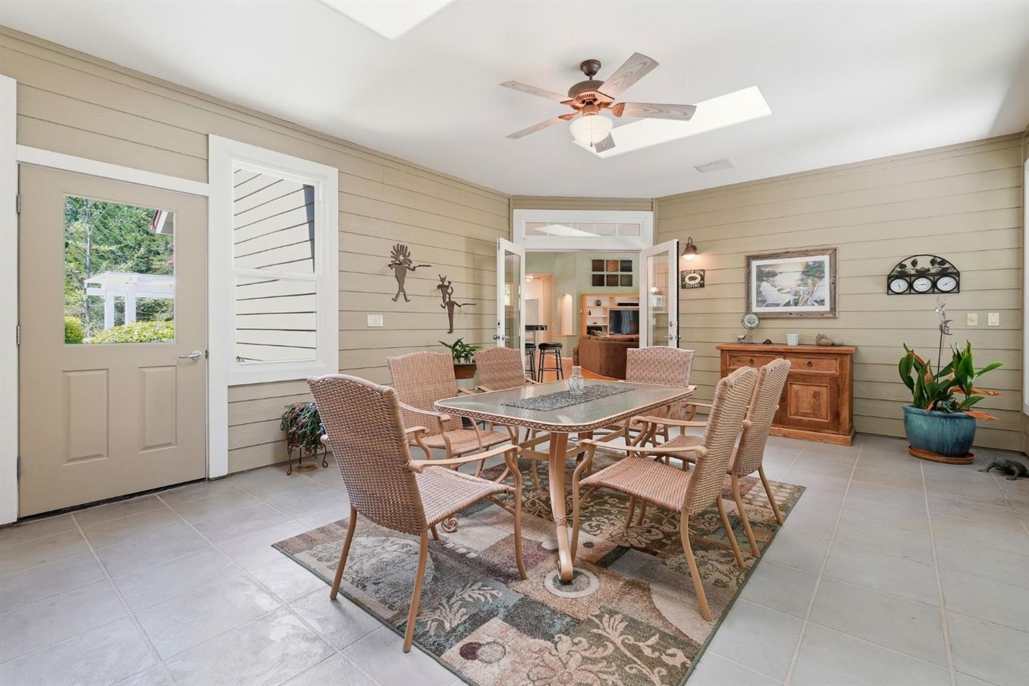 10711 Murchie Mine Road Nevada City, CA 95959 - Photo 26 of 71 a view of a dining room with furniture and chandelier