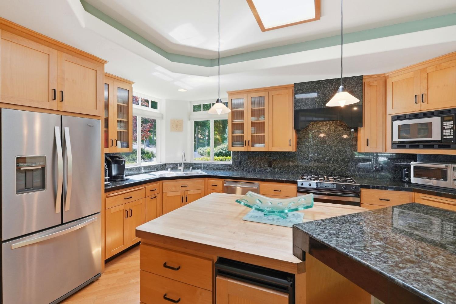 10711 Murchie Mine Road Nevada City, CA 95959 - Photo 3 of 71 a kitchen with stainless steel appliances granite countertop a sink a stove and refrigerator