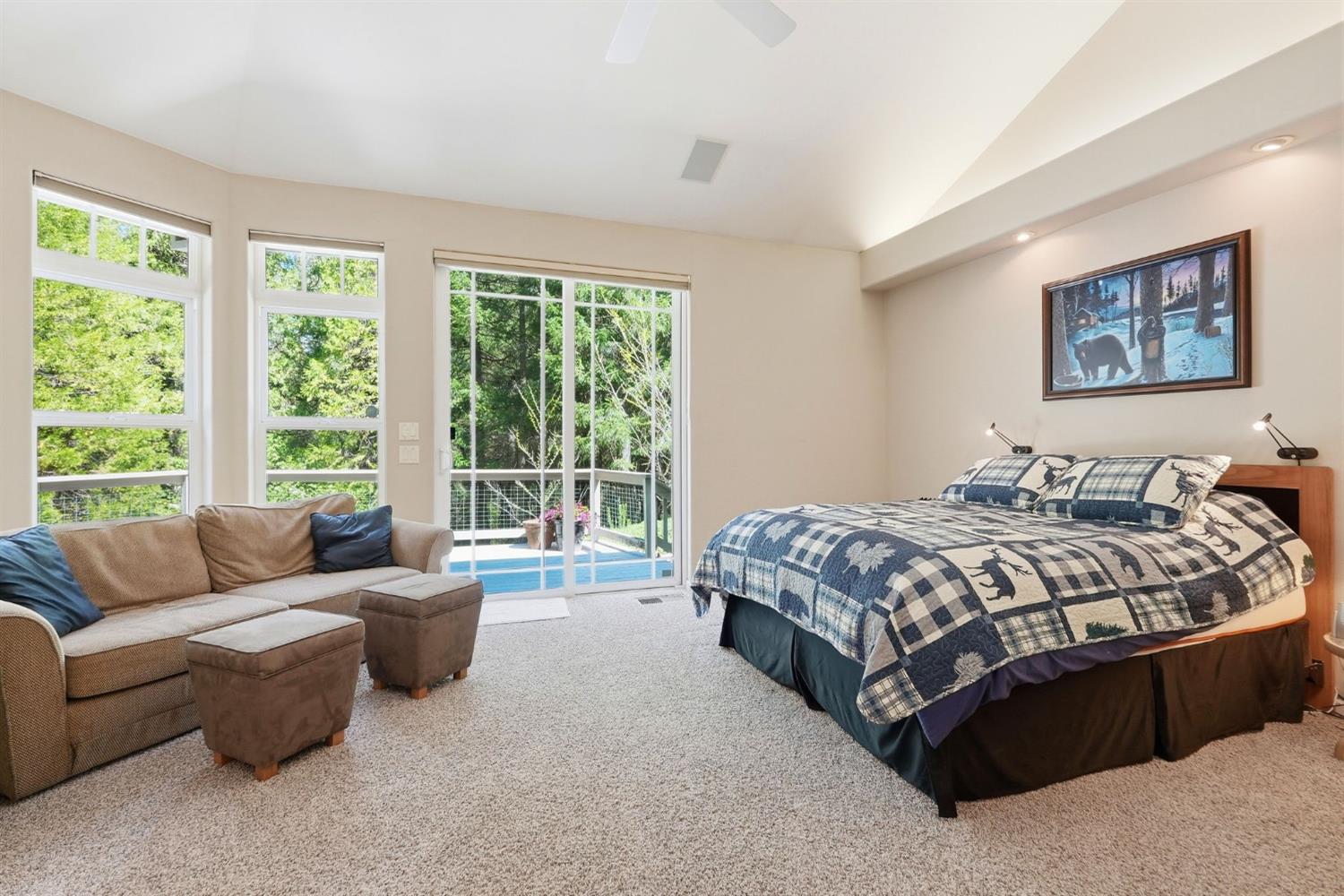 10711 Murchie Mine Road Nevada City, CA 95959 - Photo 31 of 71 a bedroom with a bed couch and a large window