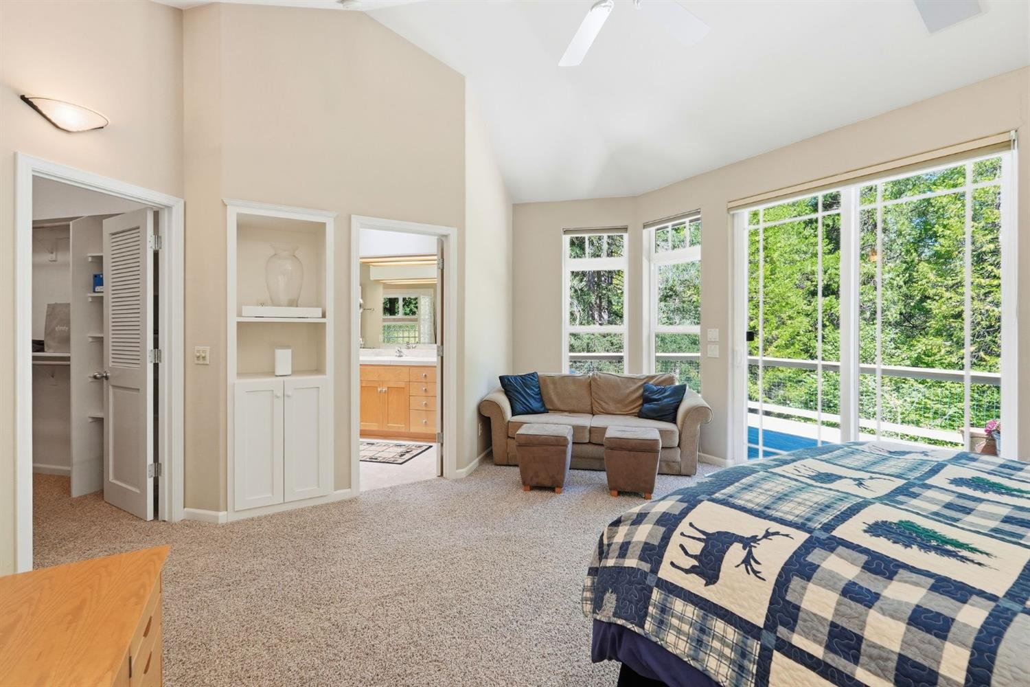 10711 Murchie Mine Road Nevada City, CA 95959 - Photo 33 of 71 a bedroom with a bed and glass windows