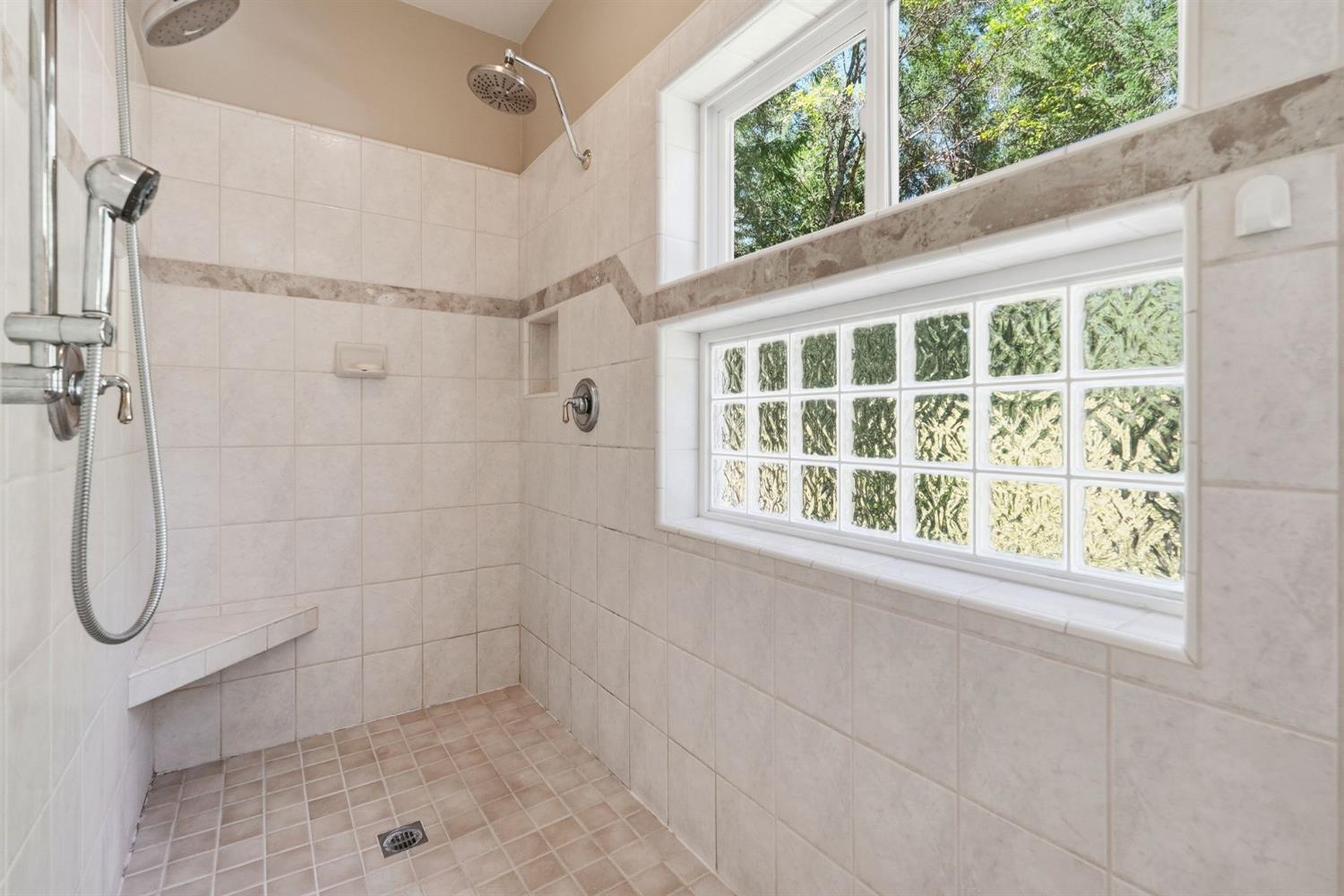 10711 Murchie Mine Road Nevada City, CA 95959 - Photo 38 of 71 a bathroom with a glass shower door