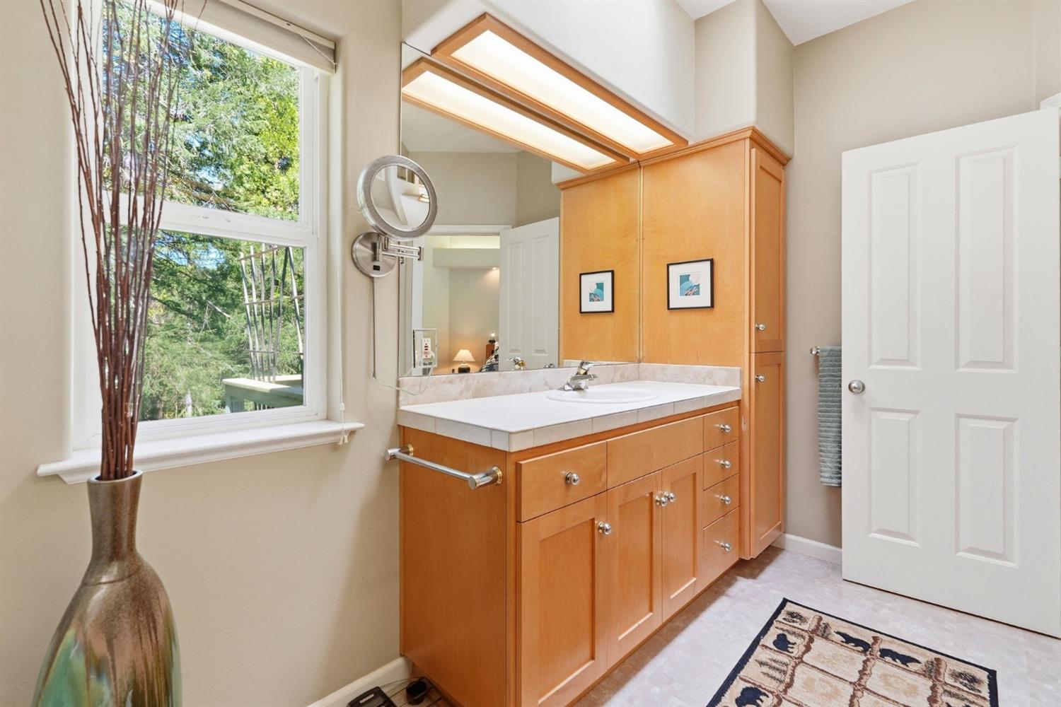 10711 Murchie Mine Road Nevada City, CA 95959 - Photo 39 of 71 a bathroom with a sink a vanity and a large mirror