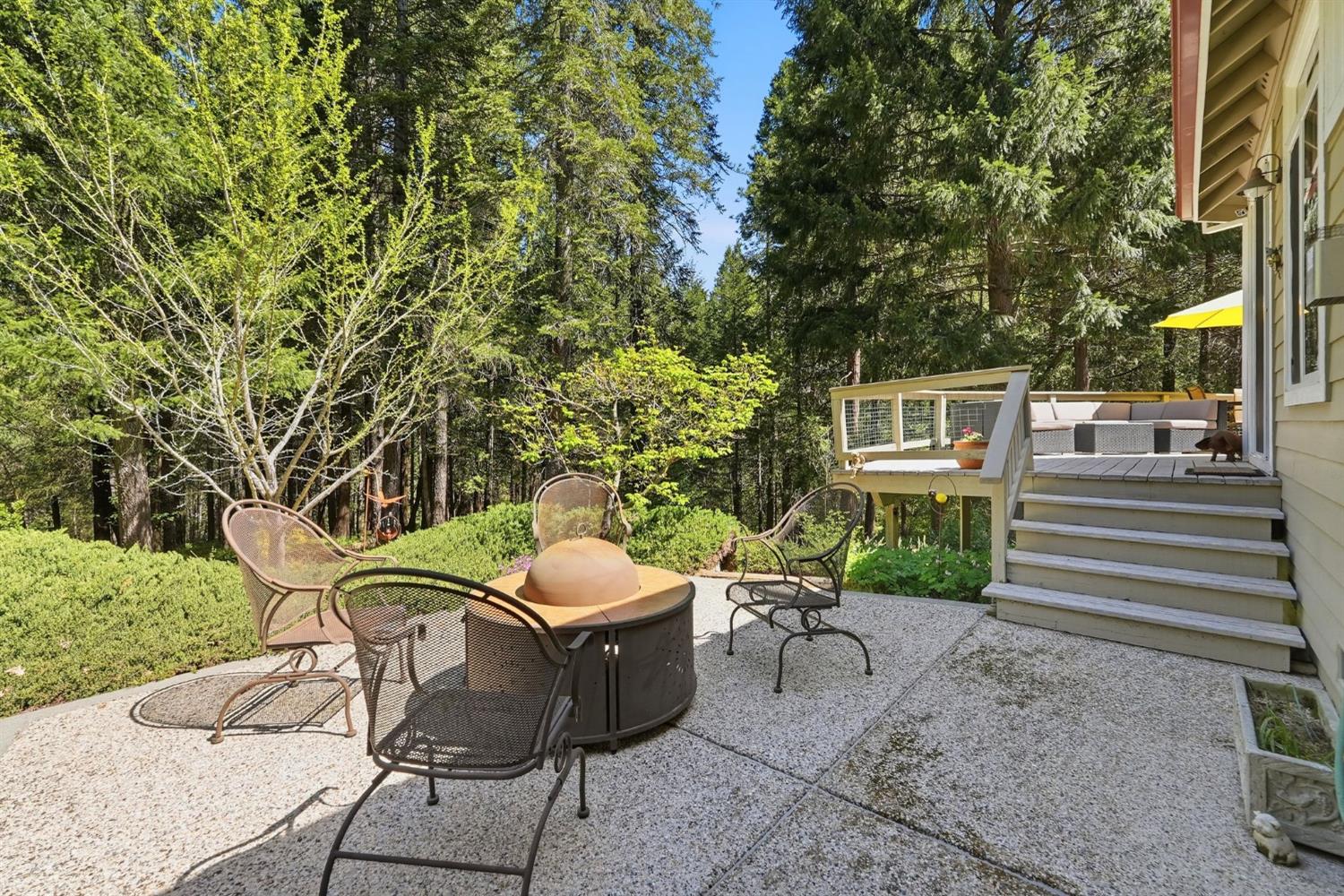 10711 Murchie Mine Road Nevada City, CA 95959 - Photo 52 of 71 a view of a patio with table and chairs and potted plants