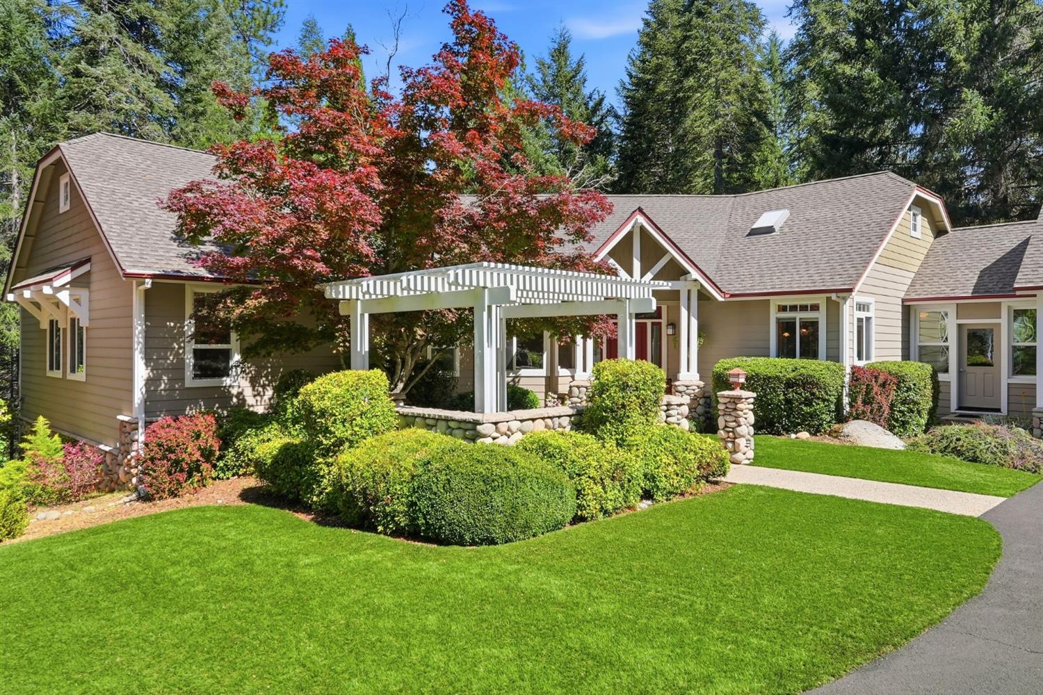 10711 Murchie Mine Road Nevada City, CA 95959 - Photo 6 of 71 a front view of a house with a yard table and chairs