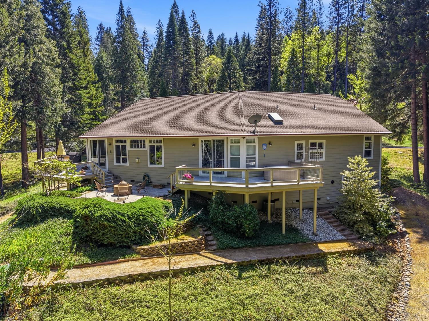 10711 Murchie Mine Road Nevada City, CA 95959 - Photo 69 of 71 a view of a house with a yard and plants