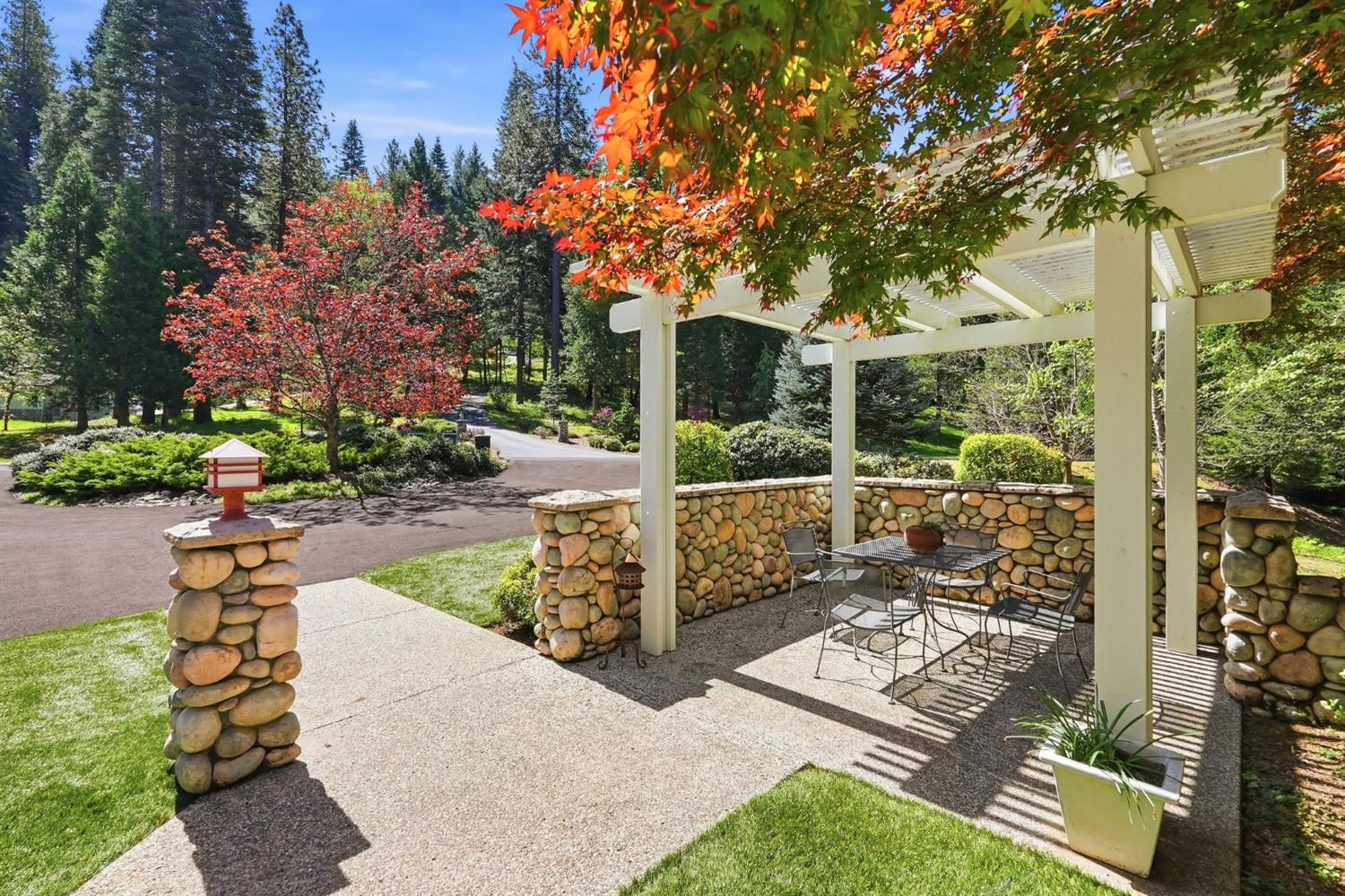 10711 Murchie Mine Road Nevada City, CA 95959 - Photo 9 of 71 a view of a patio with table and chairs and potted plants