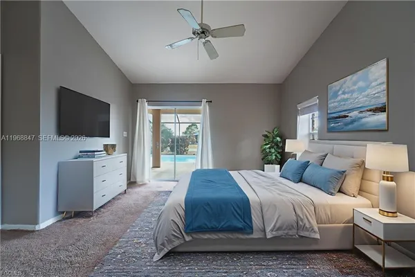 a bedroom with a large bed and a flat screen tv