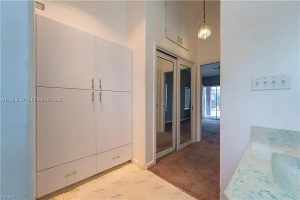 a view of a hallway with closet