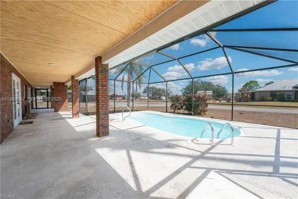 a view of a backyard with a swimming pool