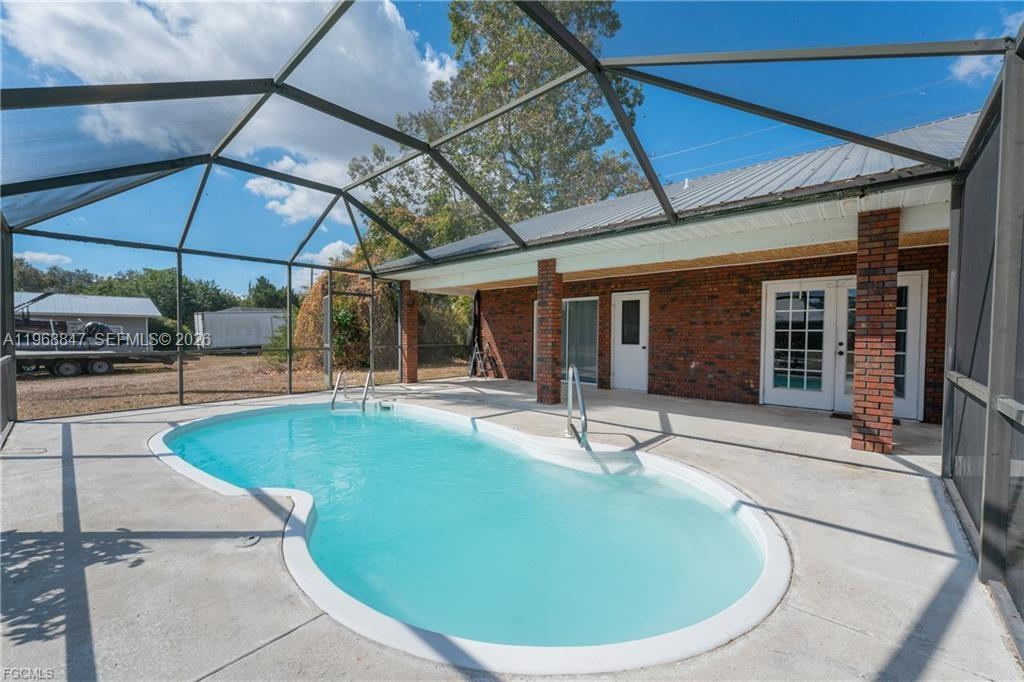 845 Quail Run LaBelle, FL 33935 - Photo 6 of 29 a view of a house with swimming pool