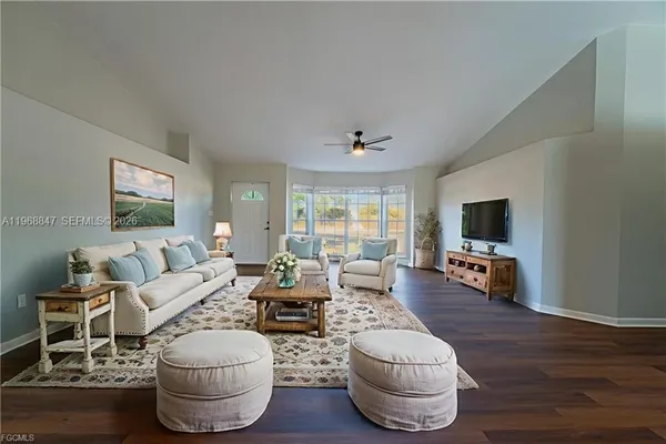 a living room with furniture and a flat screen tv