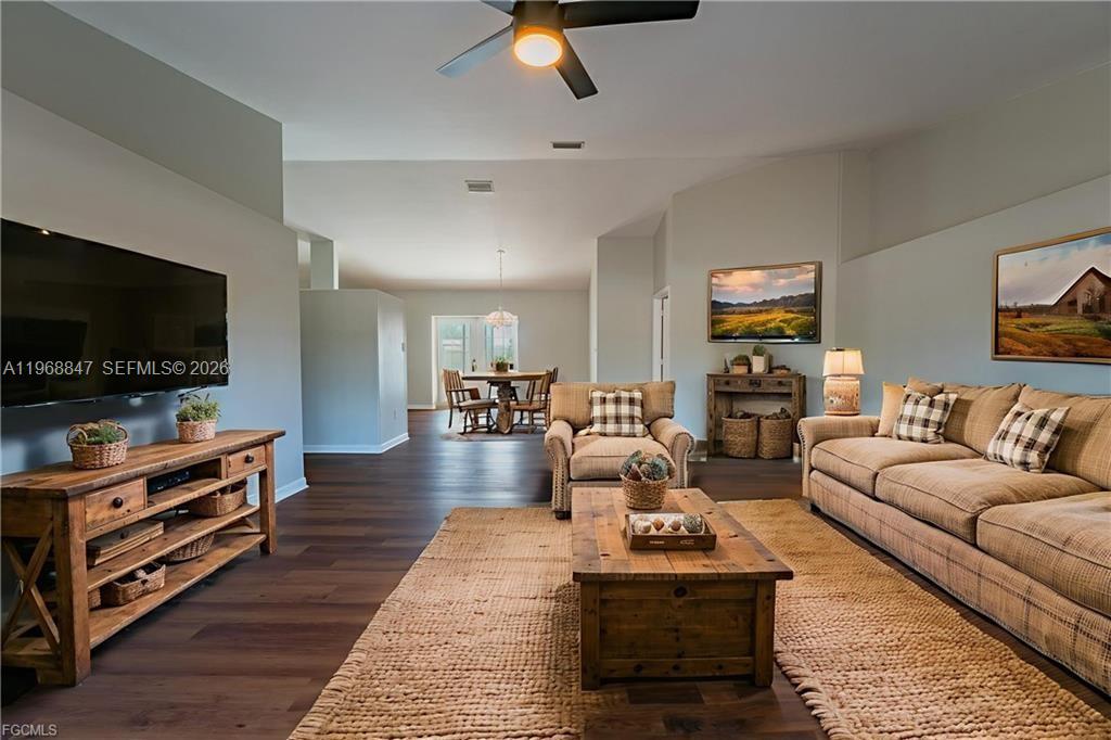 845 Quail Run LaBelle, FL 33935 - Photo 8 of 29 a living room with furniture and a flat screen tv