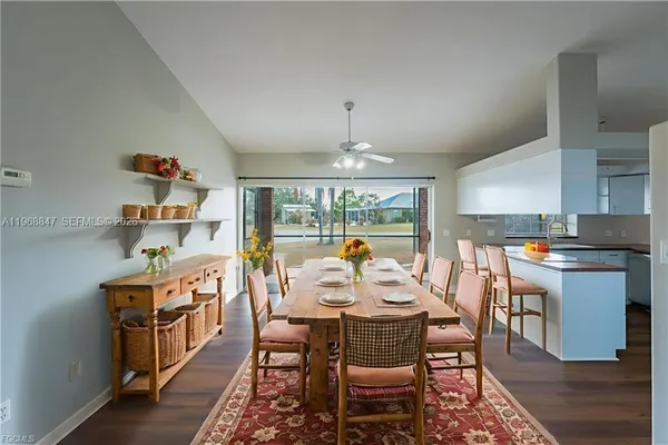a large kitchen with a table and chairs