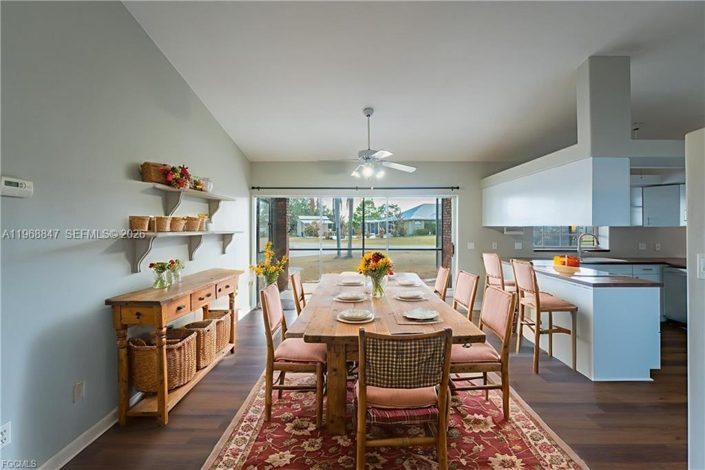 845 Quail Run LaBelle, FL 33935 - Photo 9 of 29 a large kitchen with a table and chairs