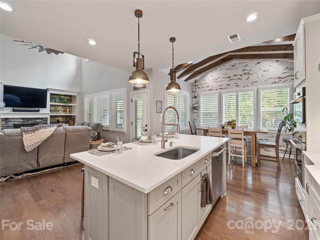 2822 Walker Road Matthews, NC 28105 - Photo 14 of 47 a kitchen with a sink stove and chairs