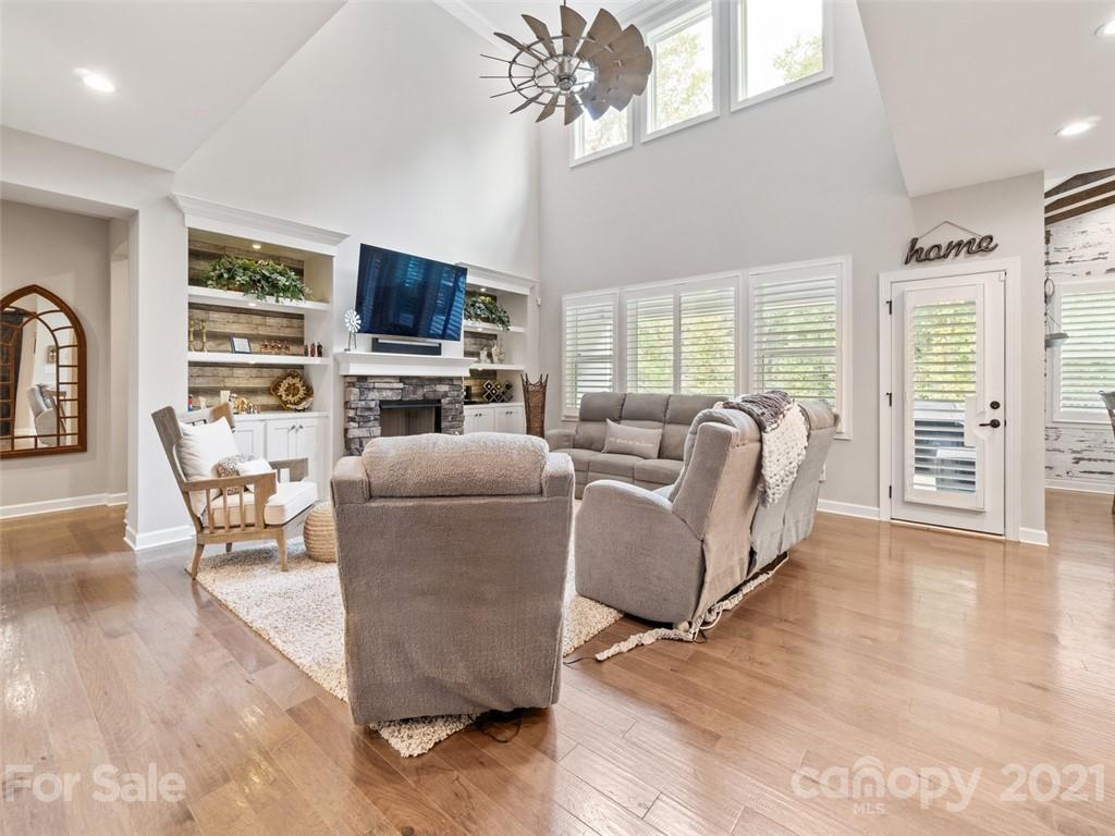 2822 Walker Road Matthews, NC 28105 - Photo 15 of 47 a living room with furniture a flat screen tv and a large window