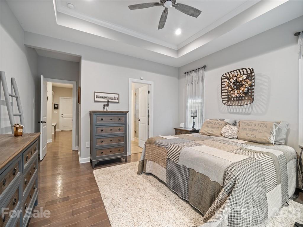 2822 Walker Road Matthews, NC 28105 - Photo 24 of 47 a spacious bedroom with a bed and a walk in closet