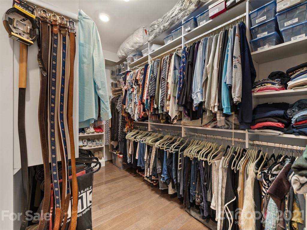 2822 Walker Road Matthews, NC 28105 - Photo 29 of 47 a view of walk in closet with clothes and shoes