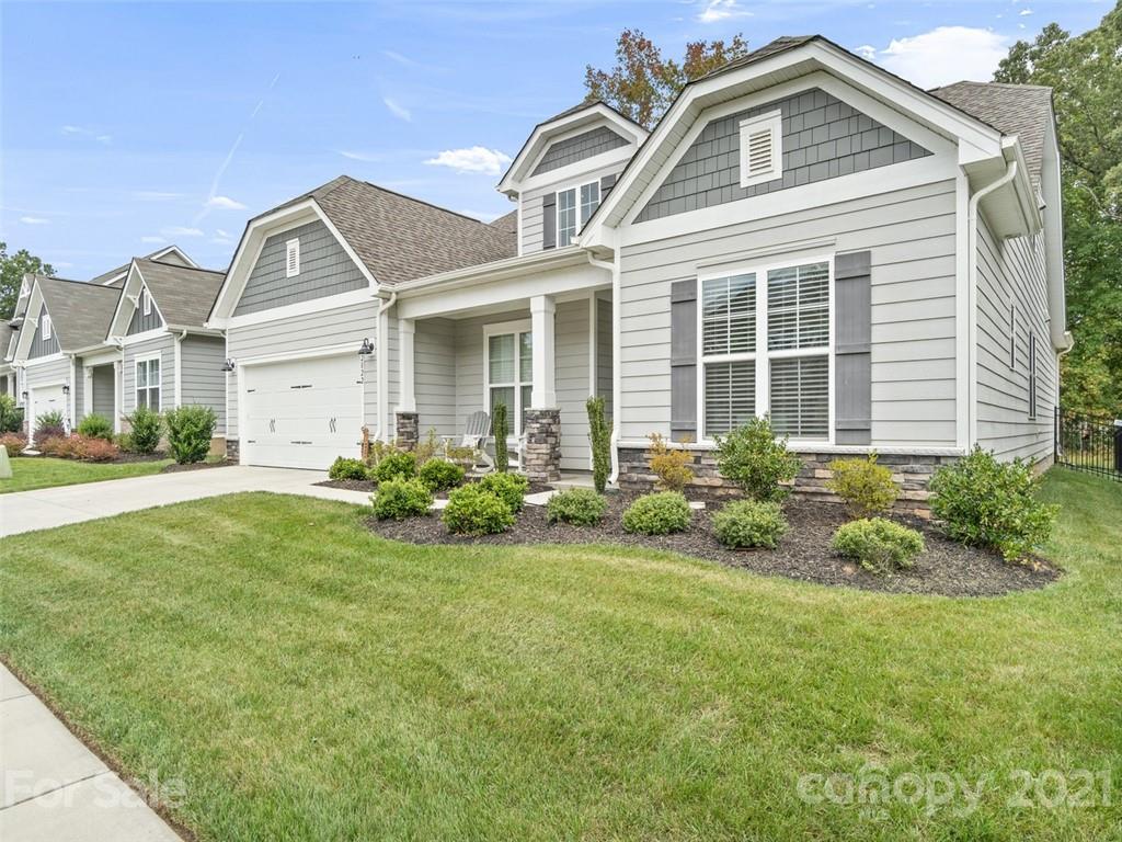 2822 Walker Road Matthews, NC 28105 - Photo 4 of 47 a front view of a house with a garden