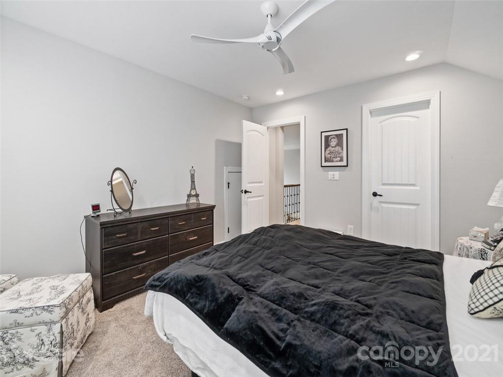 2822 Walker Road Matthews, NC 28105 - Photo 40 of 47 a bedroom with a bed and a dresser