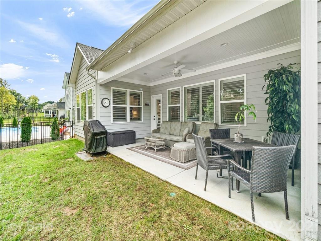 2822 Walker Road Matthews, NC 28105 - Photo 44 of 47 a view of a house with backyard sitting area and garden