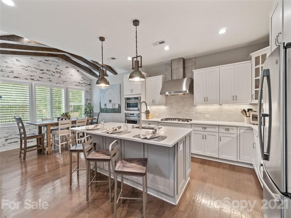 2822 Walker Road Matthews, NC 28105 - Photo 6 of 47 a kitchen with stainless steel appliances granite countertop a sink stove and refrigerator