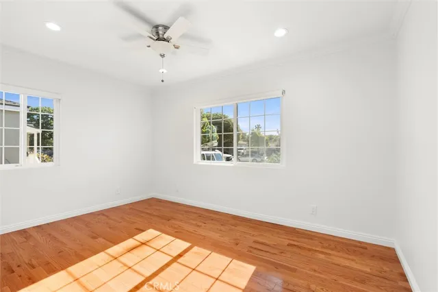 a view of a room with a ceiling fan