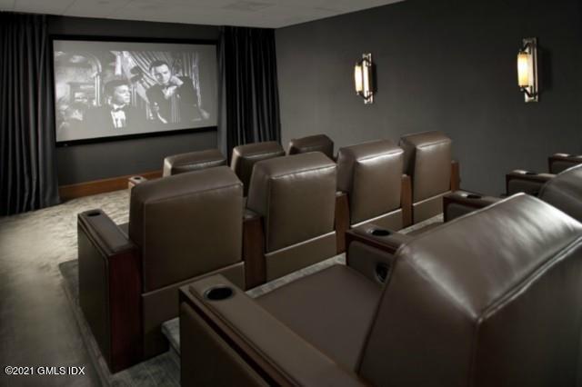 70 Forest Street, Unit 5E Stamford, CT 06901 - Photo 14 of 15 a projector room with furniture and screen tv